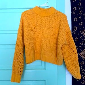 Yellow turtleneck sweater